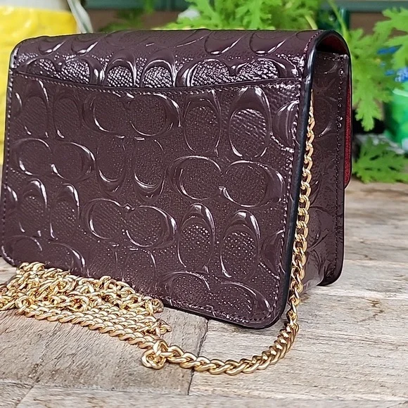 Coach Embossed Brown Crossbody Bag with Gold Chain